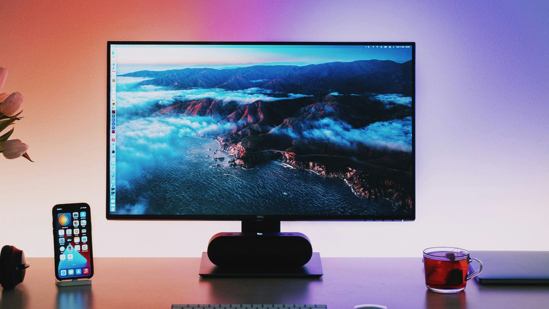 black flat screen computer monitor on brown wooden desk