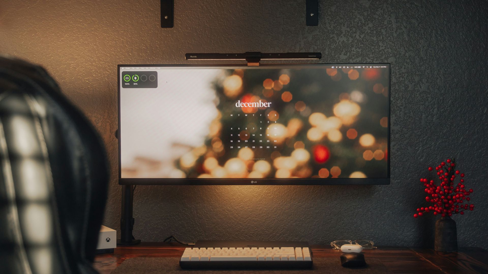 A computer desk with a monitor and keyboard