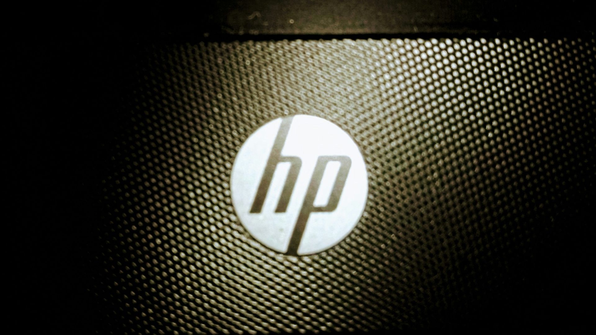 a close up of a hp logo on a laptop
