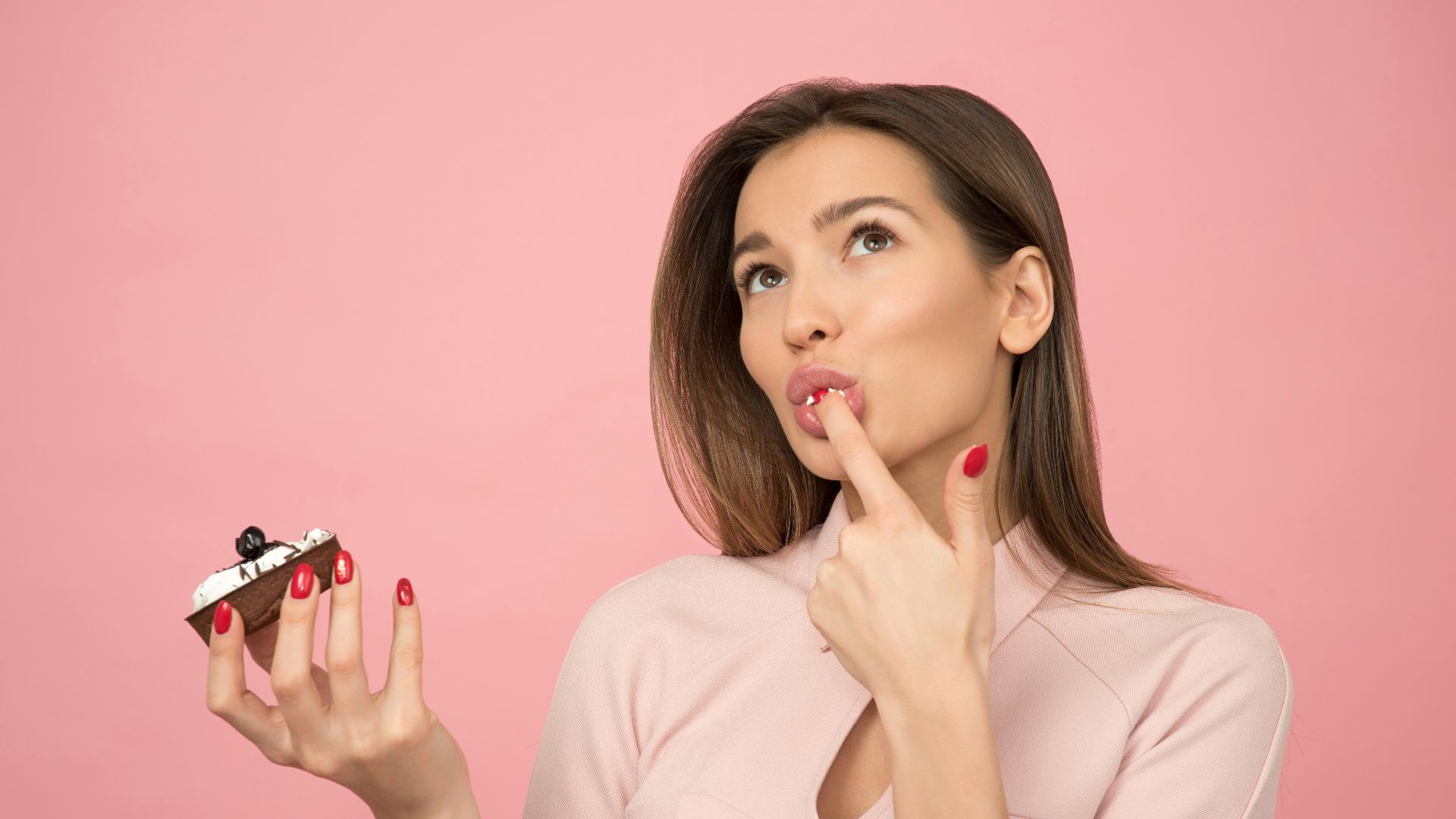 woman holding cake looking up
