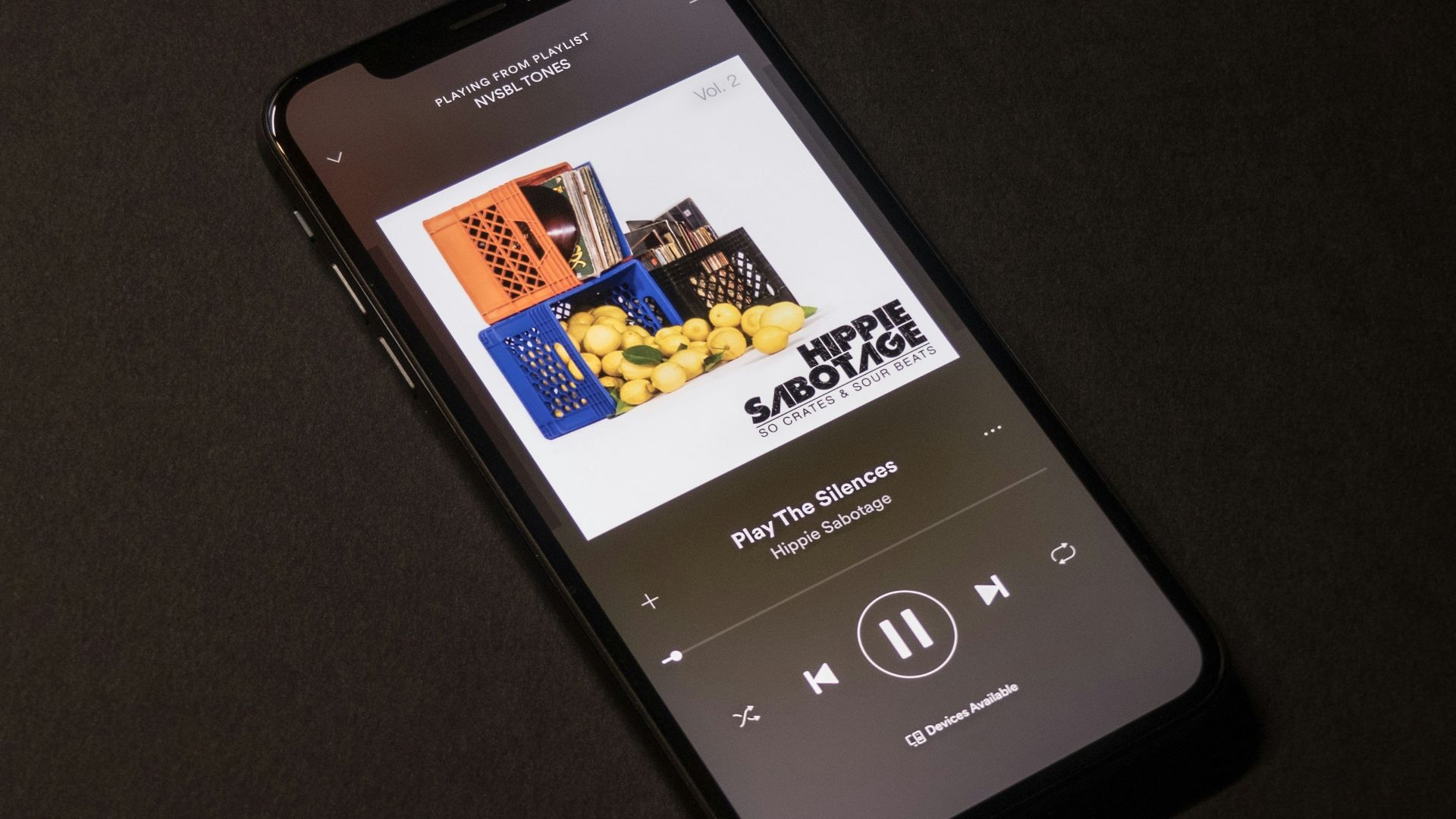 space gray iPhone X showing Spotify application
