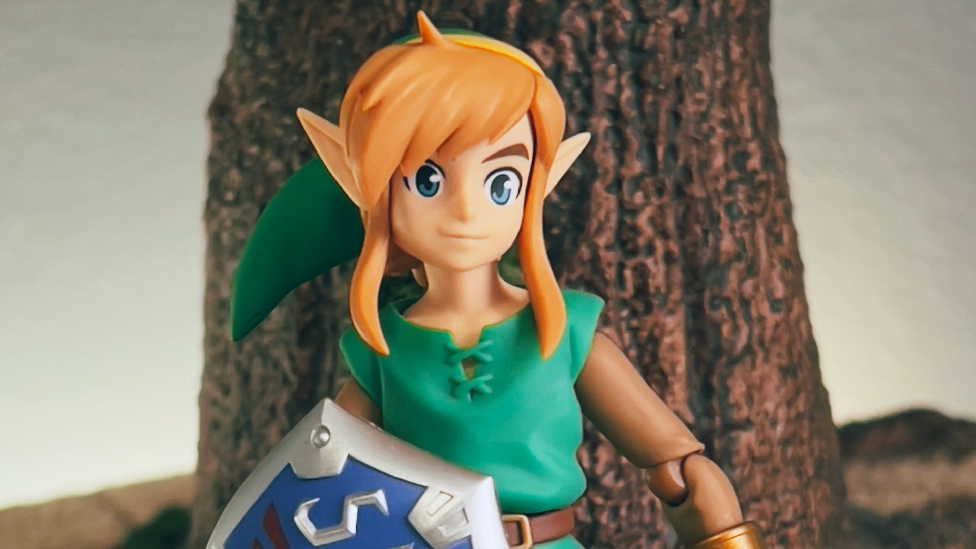 a toy girl holding a sign