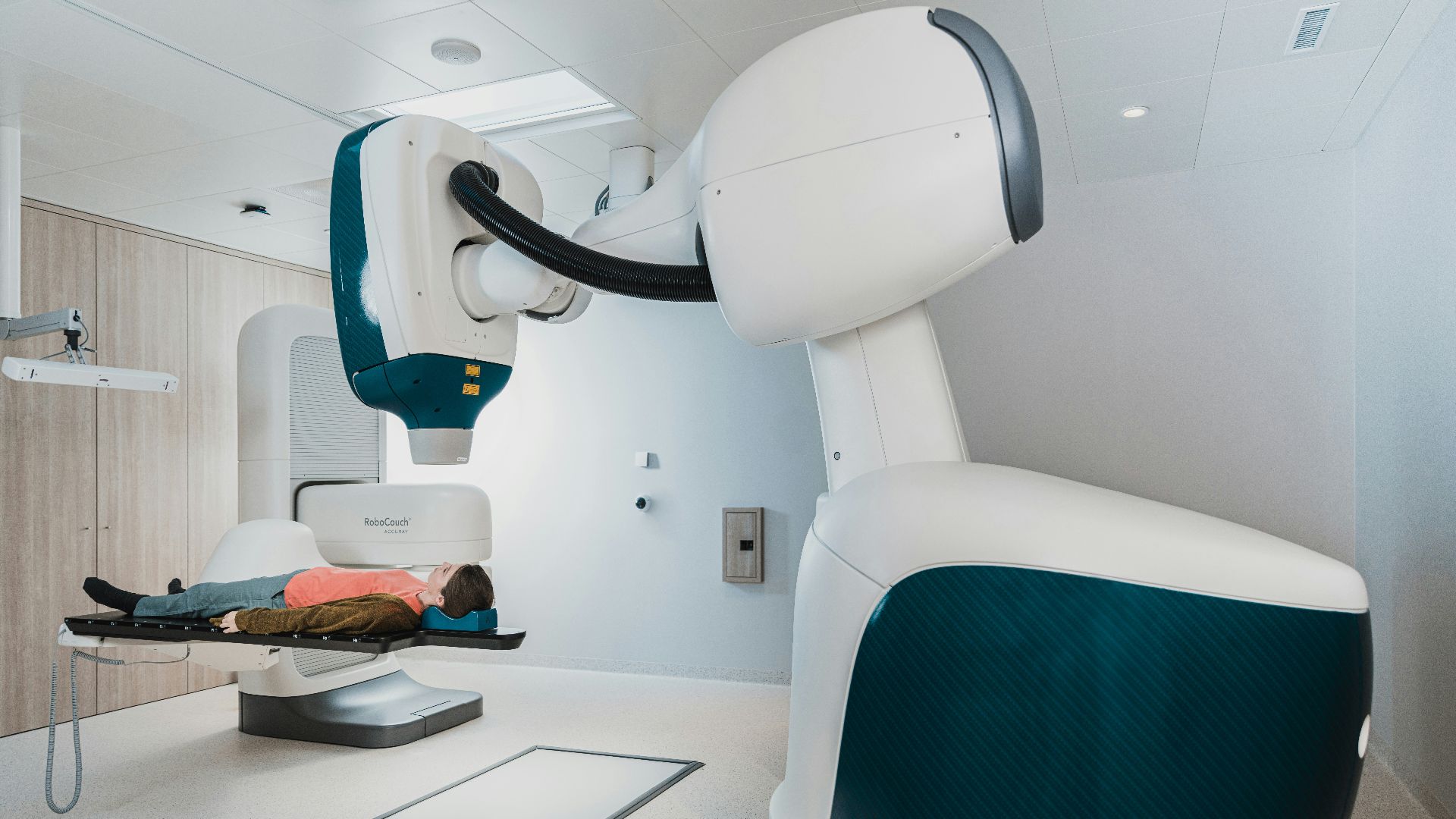 a person lying in a hospital bed