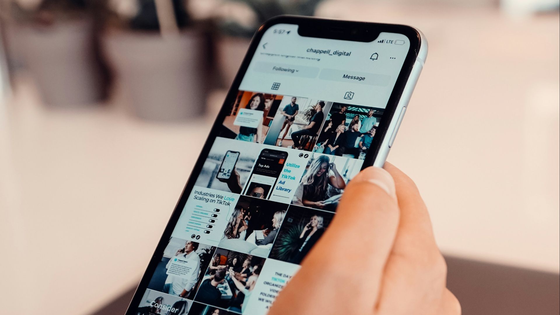 a person using a cell phone on a table