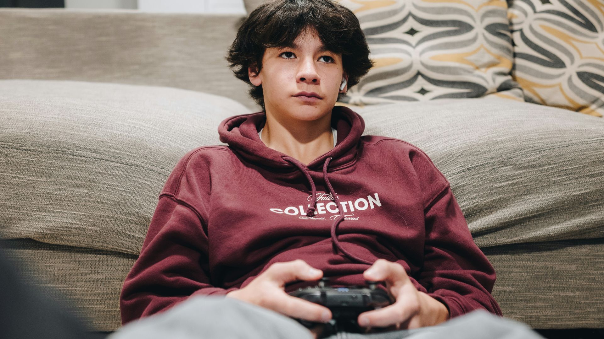 A young boy is playing a video game.