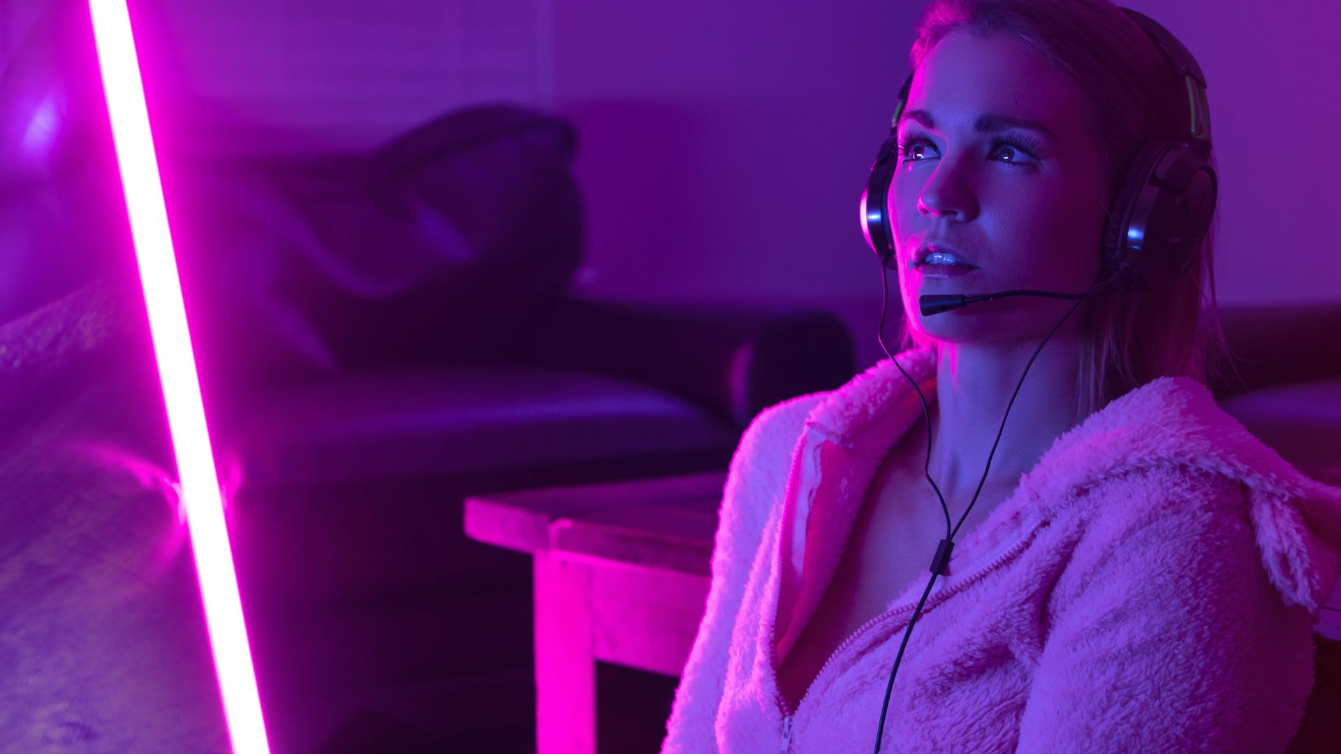 woman in white robe sitting on couch