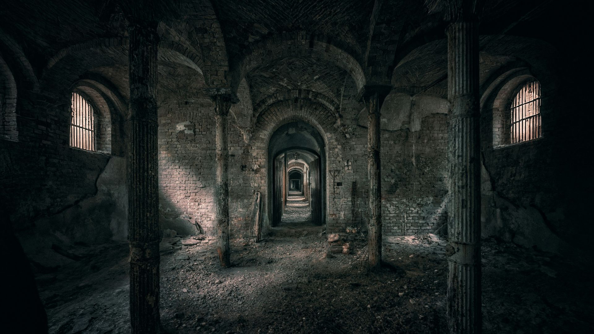 A dark tunnel with a person standing in it
