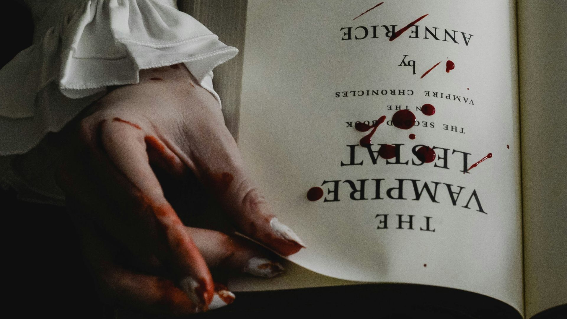 a person holding an open book in their hands