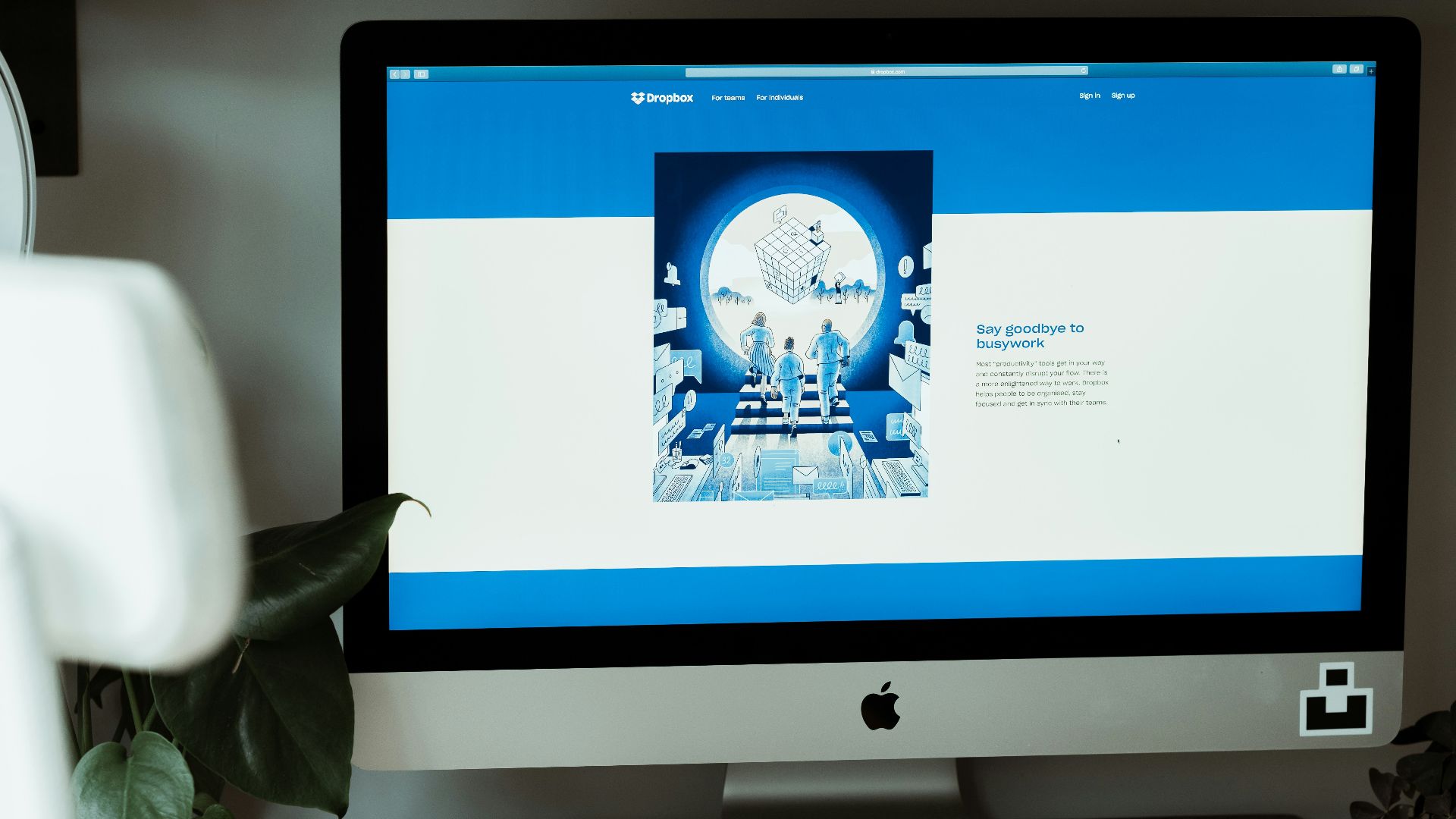 silver imac on brown wooden table
