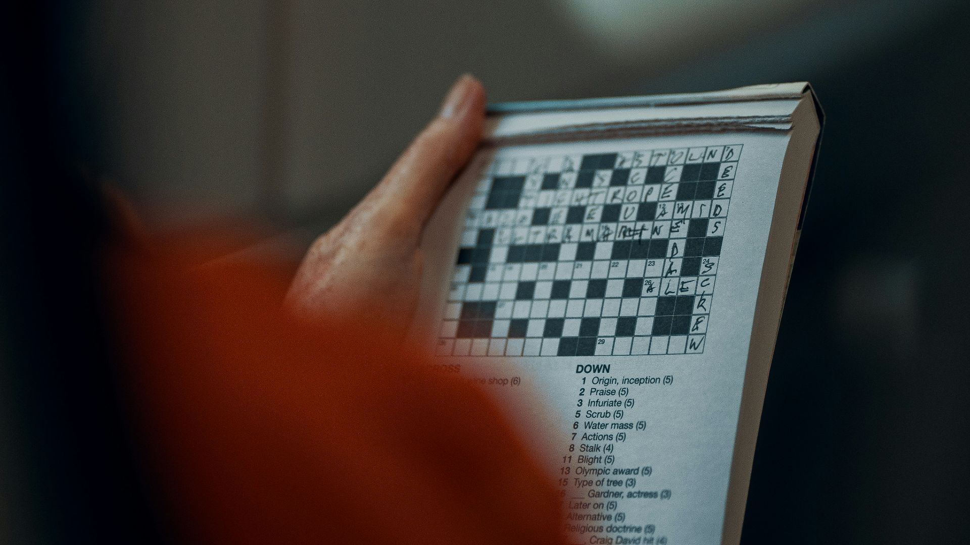 person holding white and black paper