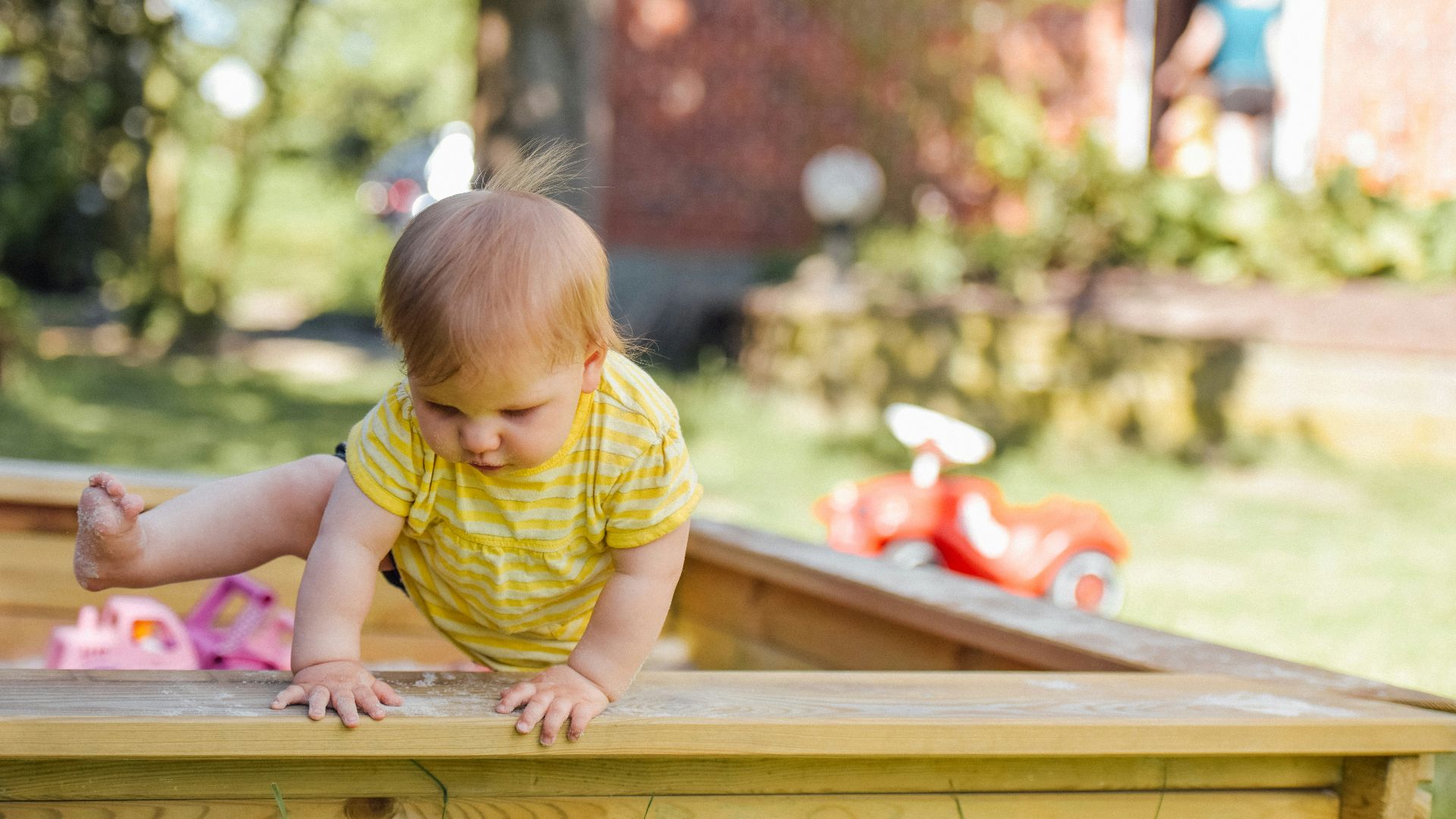 baby trying to get out of his crib