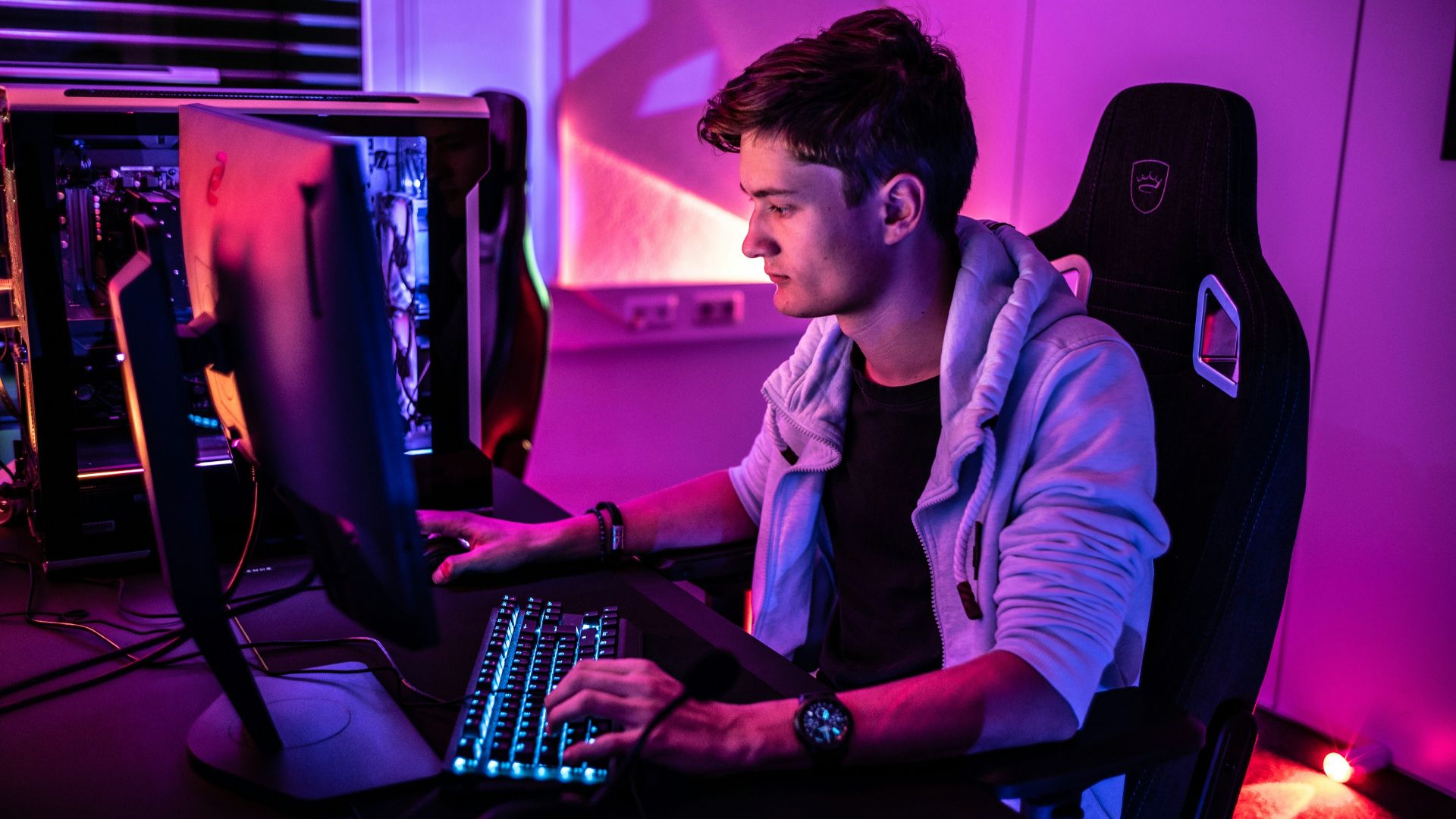 a man sitting in front of a computer keyboard
