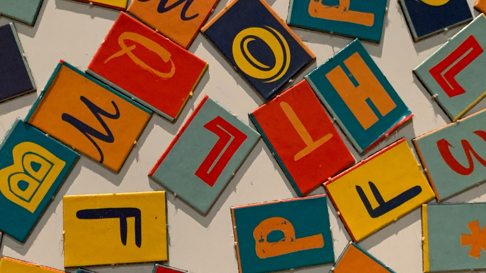 red blue yellow and white letter m