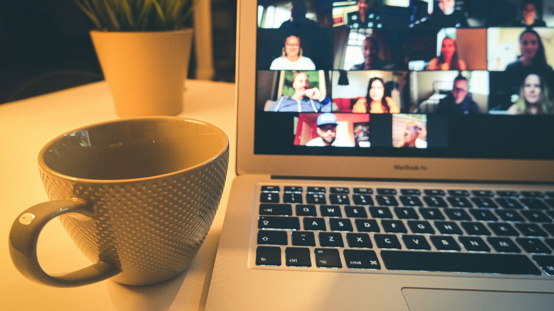 macbook air displaying woman in white shirt
