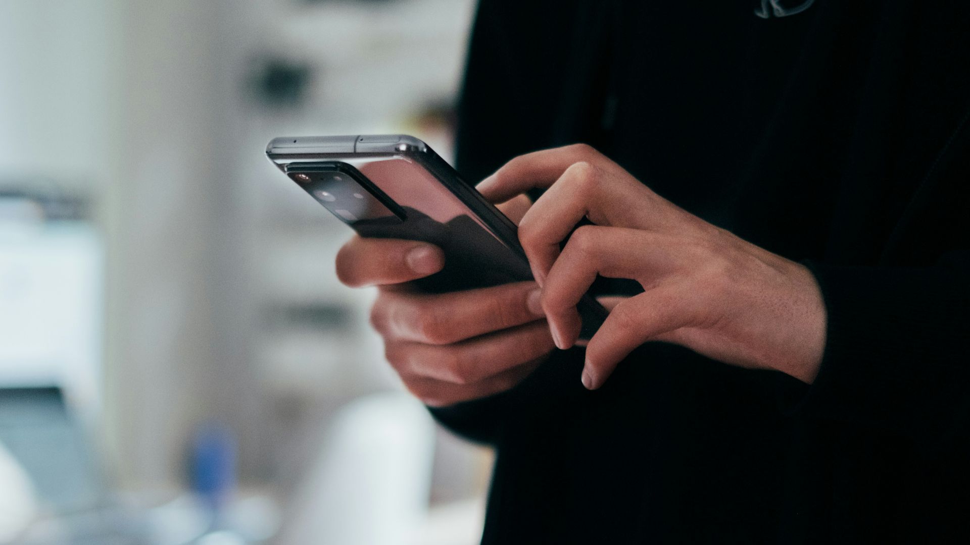 person holding black android smartphone