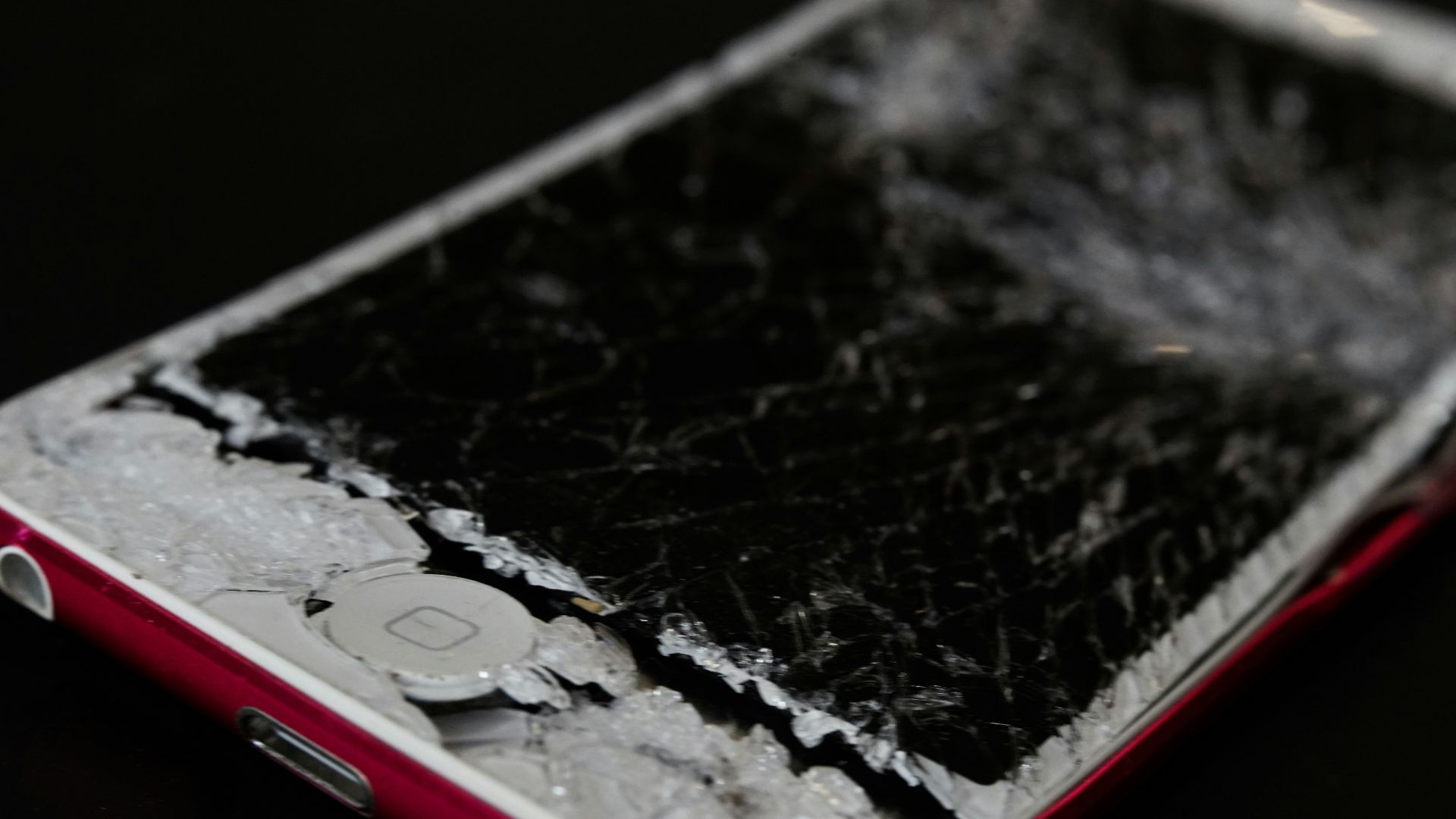 white iphone 5 c on black surface