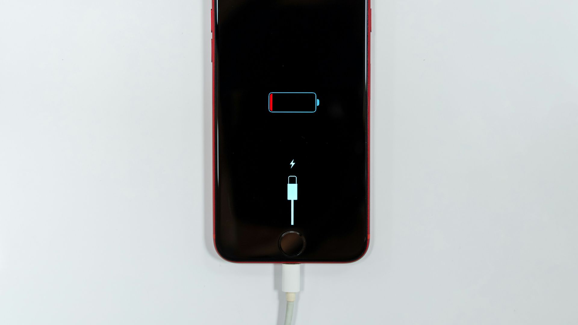 black iphone 5 on white surface