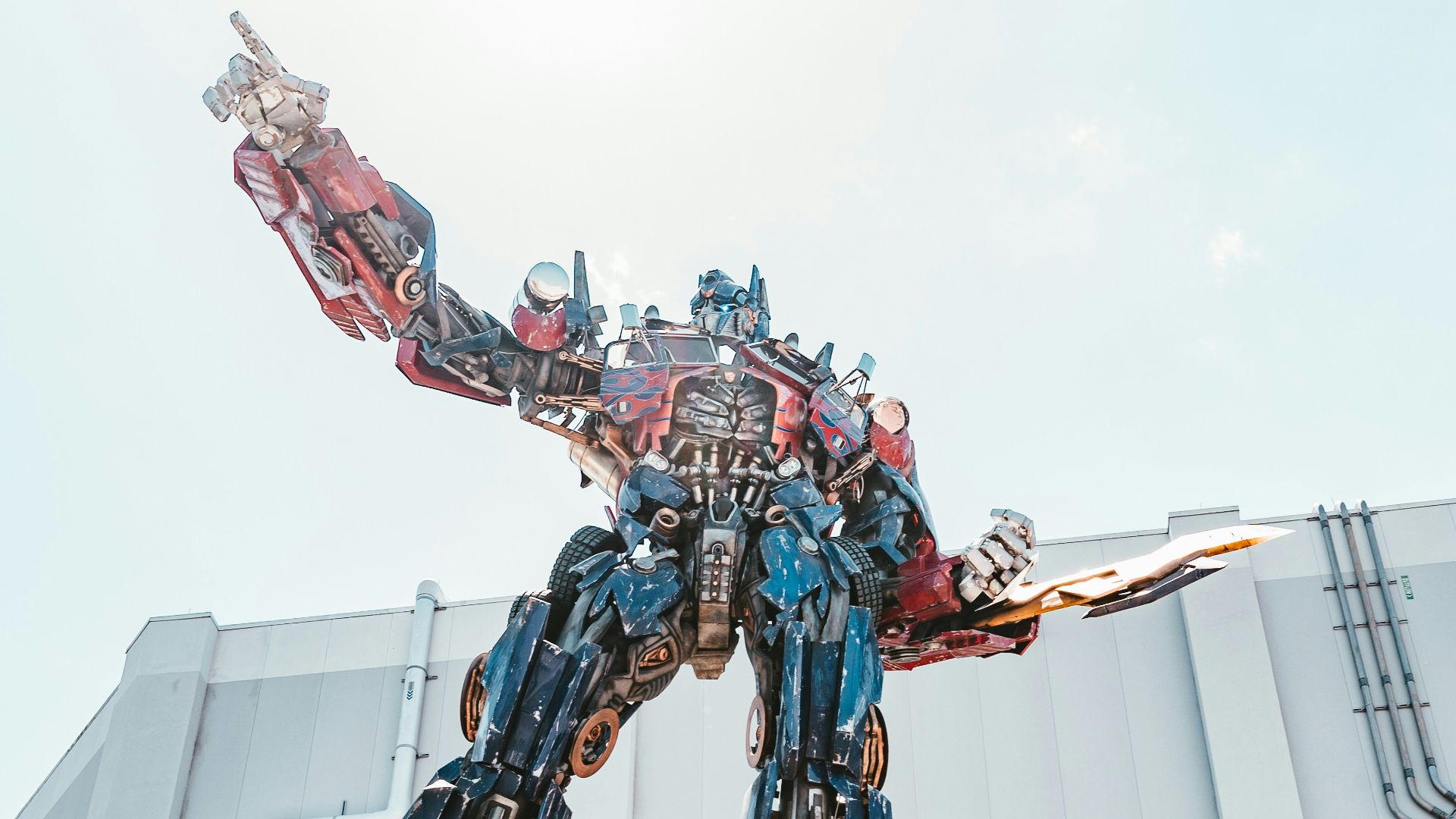 man in red and black suit statue