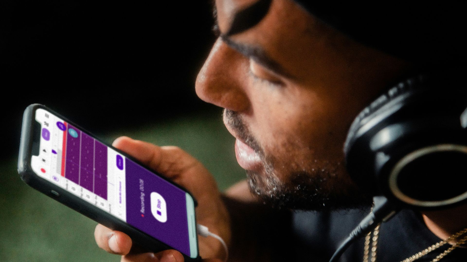 man holding blue and white smartphone