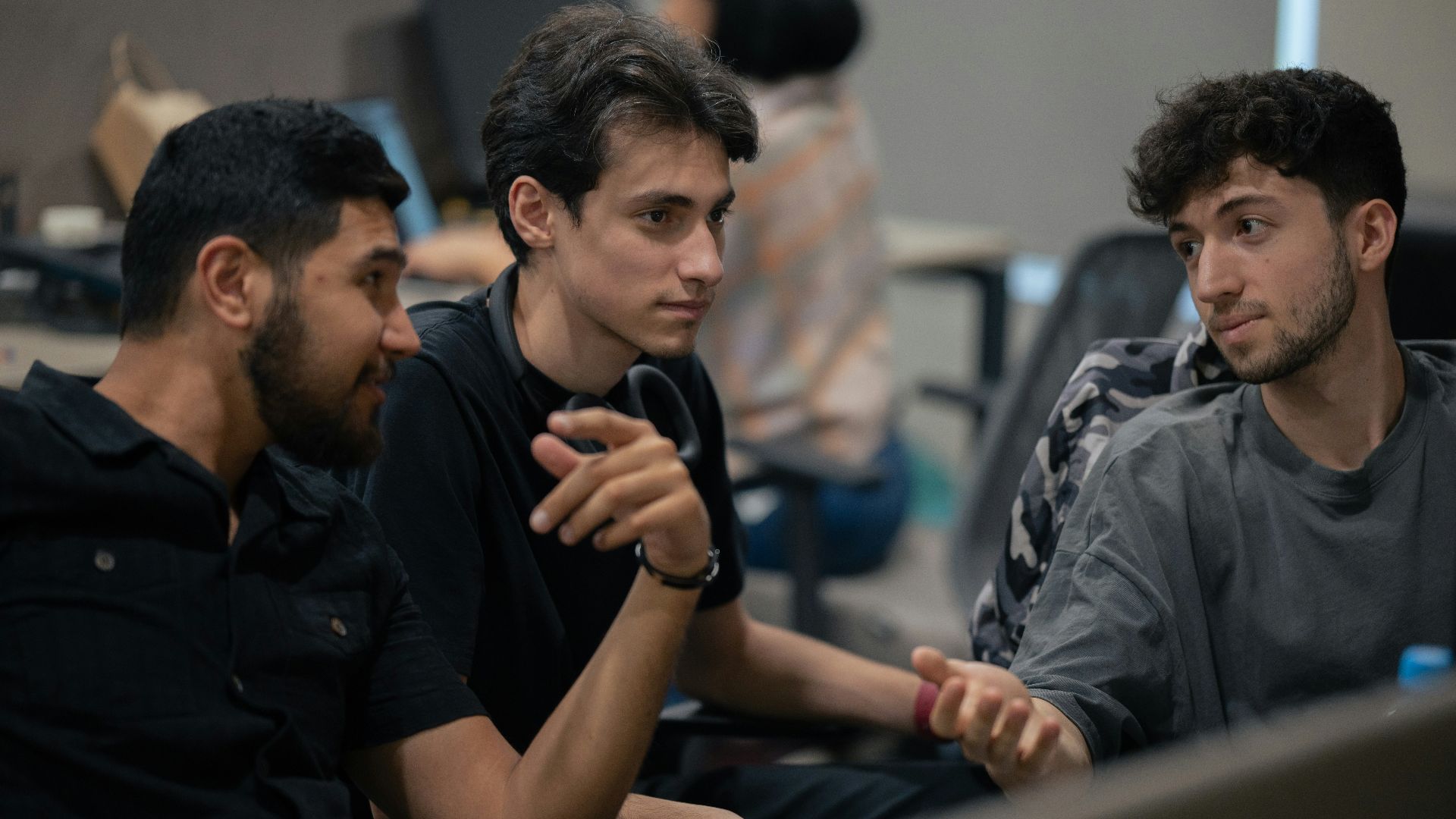 A group of men sitting next to each other