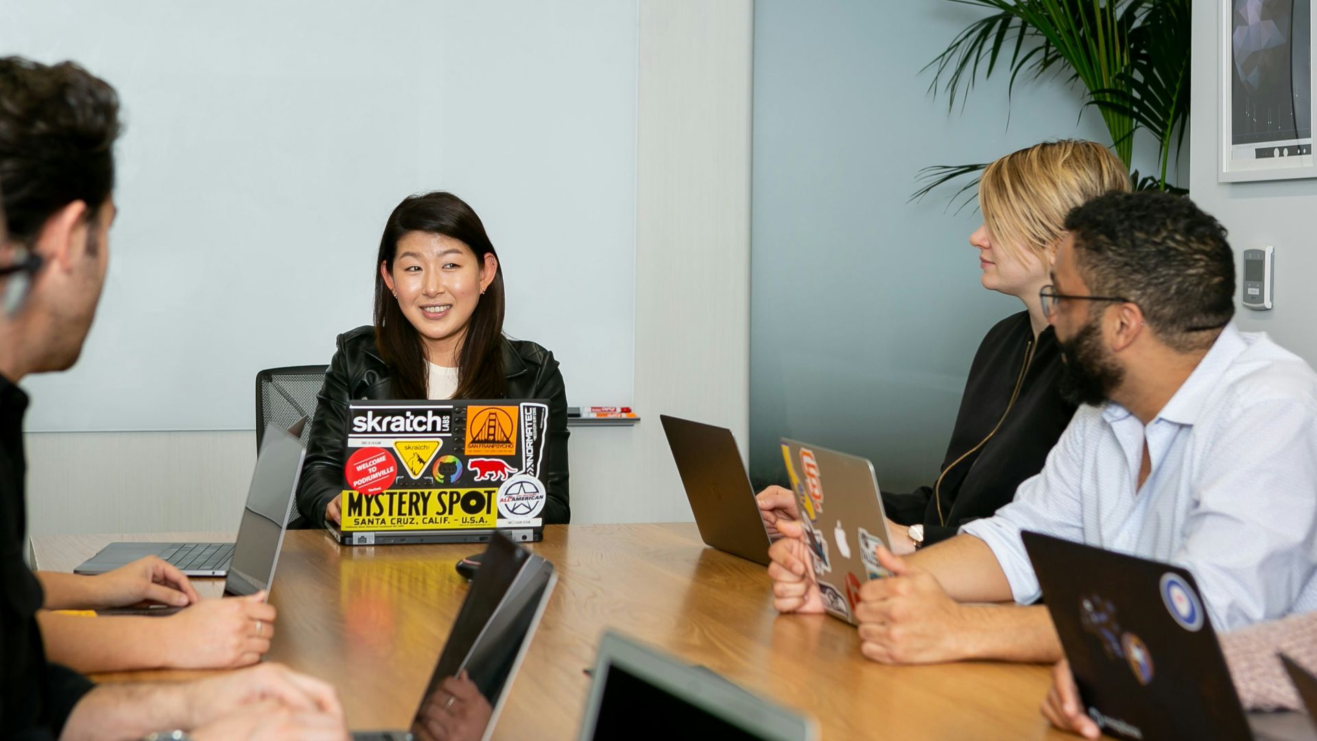 people in a meeting discussing app development