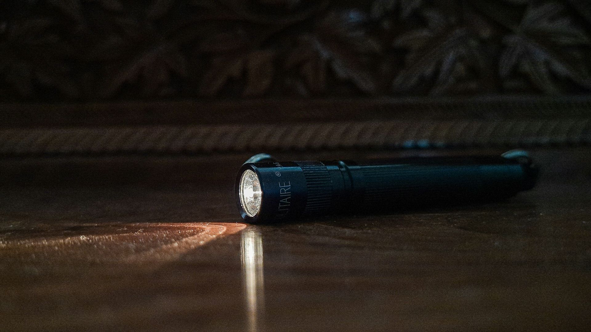 a flashlight sitting on the floor of a room