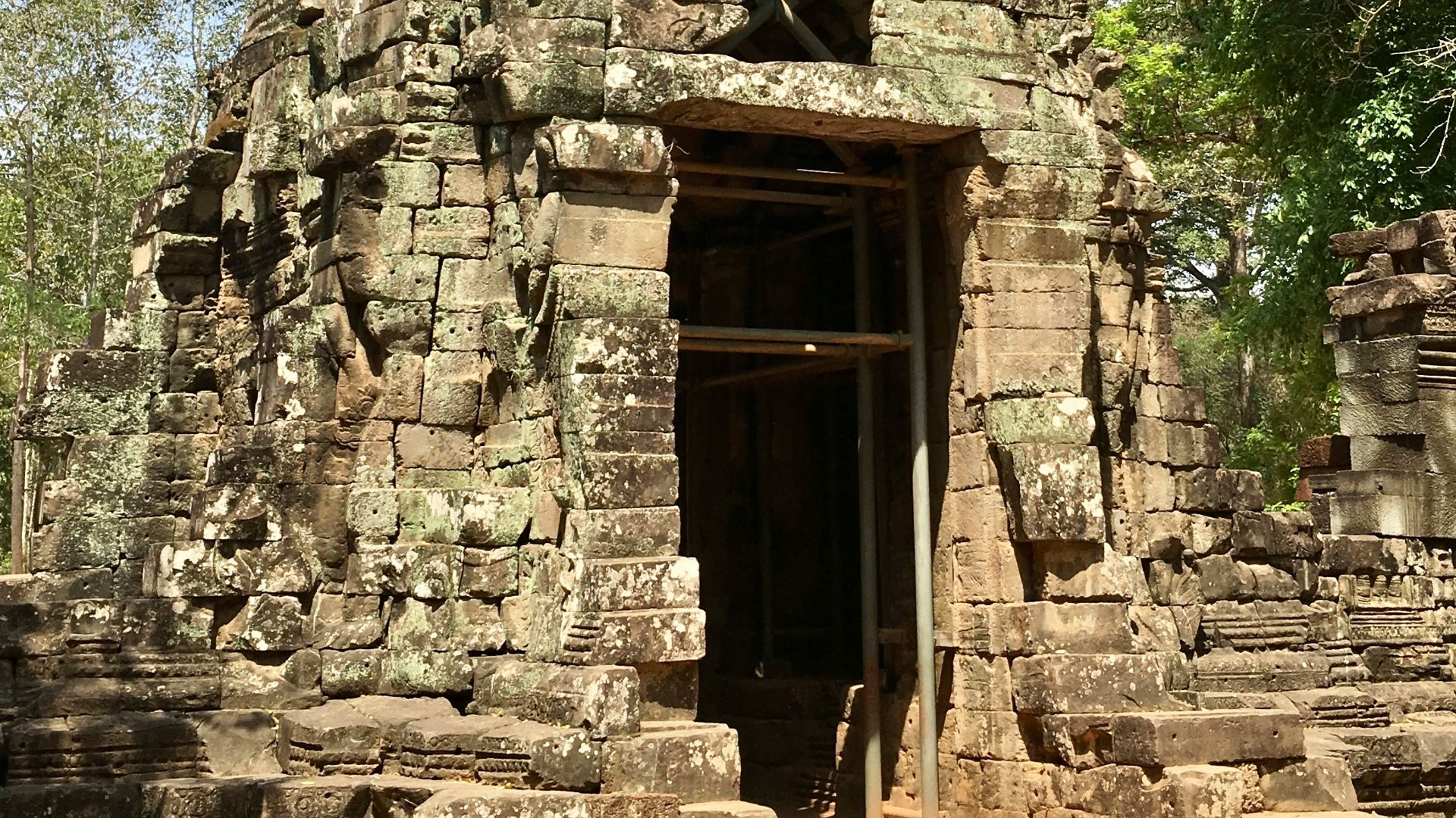 a large stone structure with a door in the middle of it