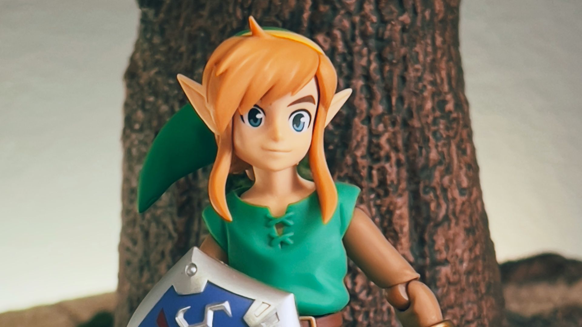 a toy girl holding a sign