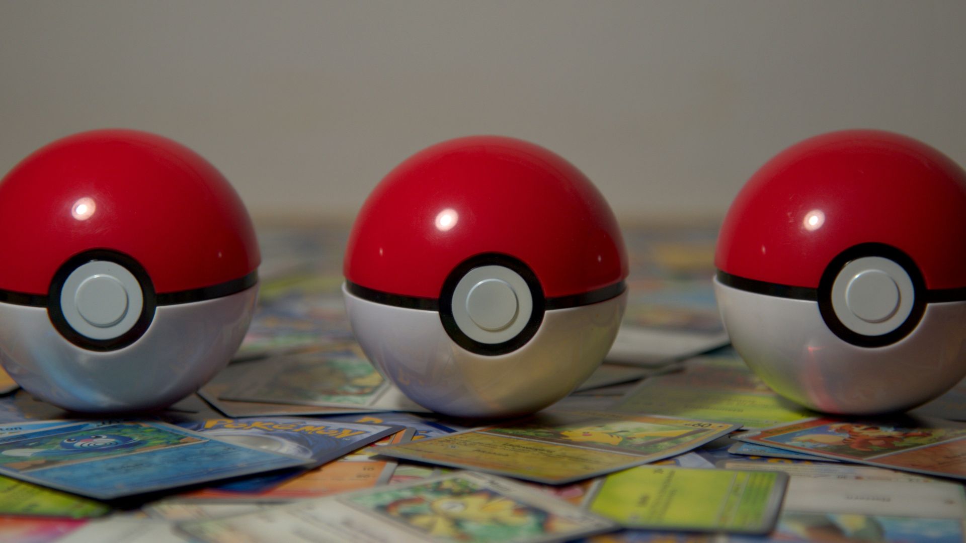 three pokemon balls sitting on top of a table
