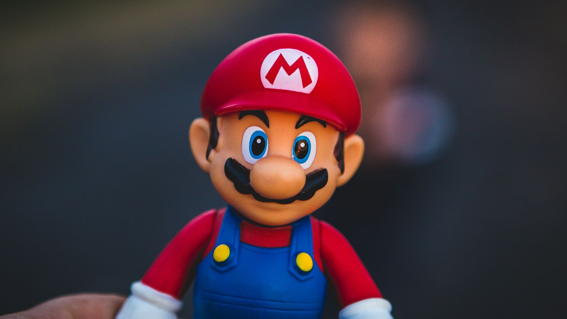 super mario in blue and red shirt figurine