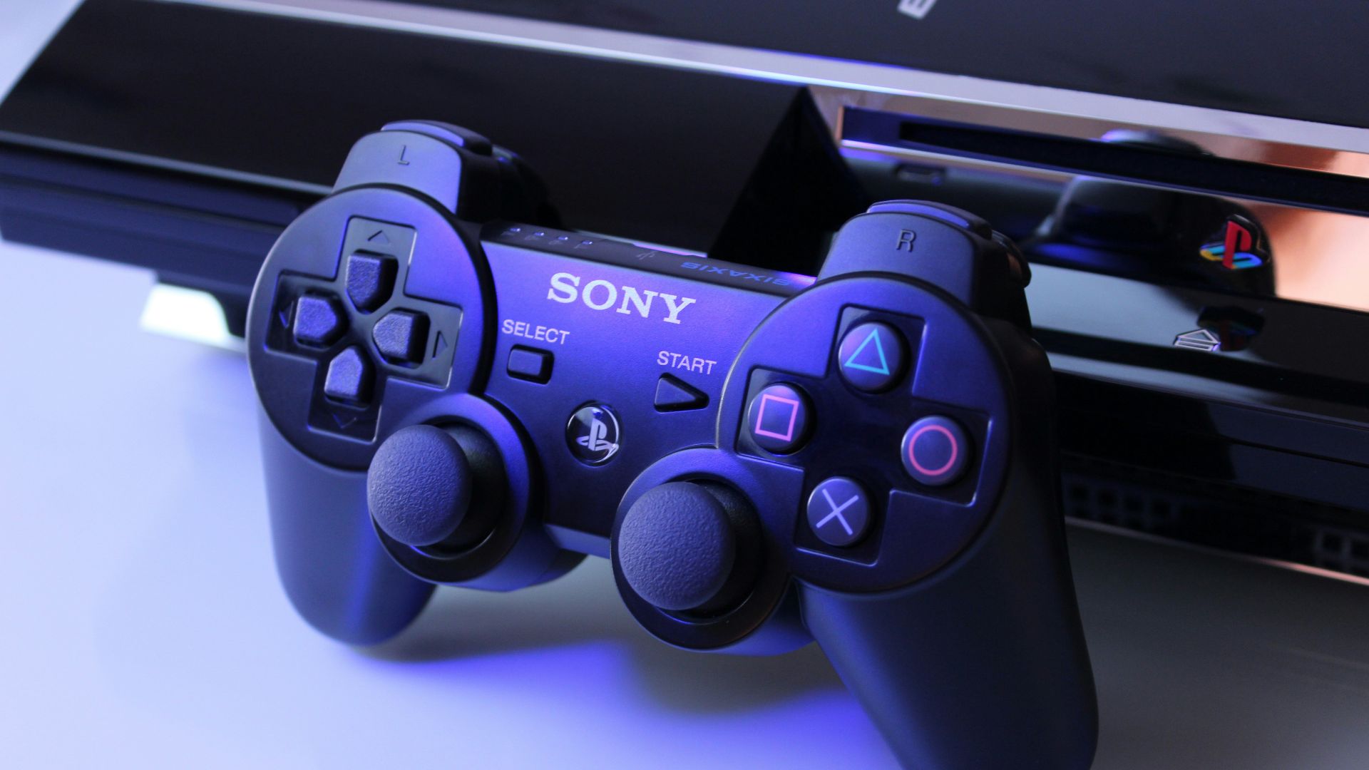 black Sony PS2 controller on white surface