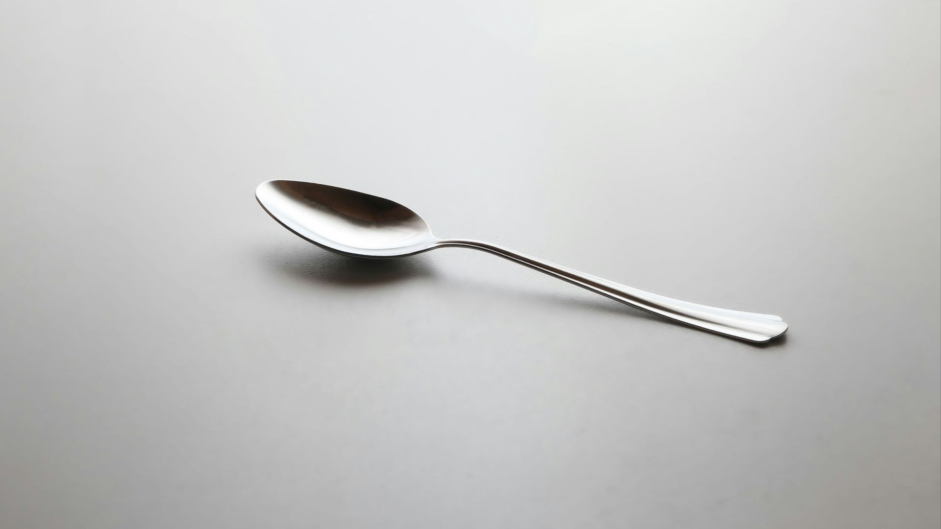 silver spoon on white table