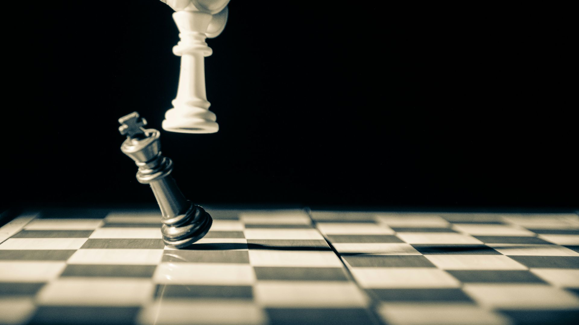 grayscale photo of person holding glass