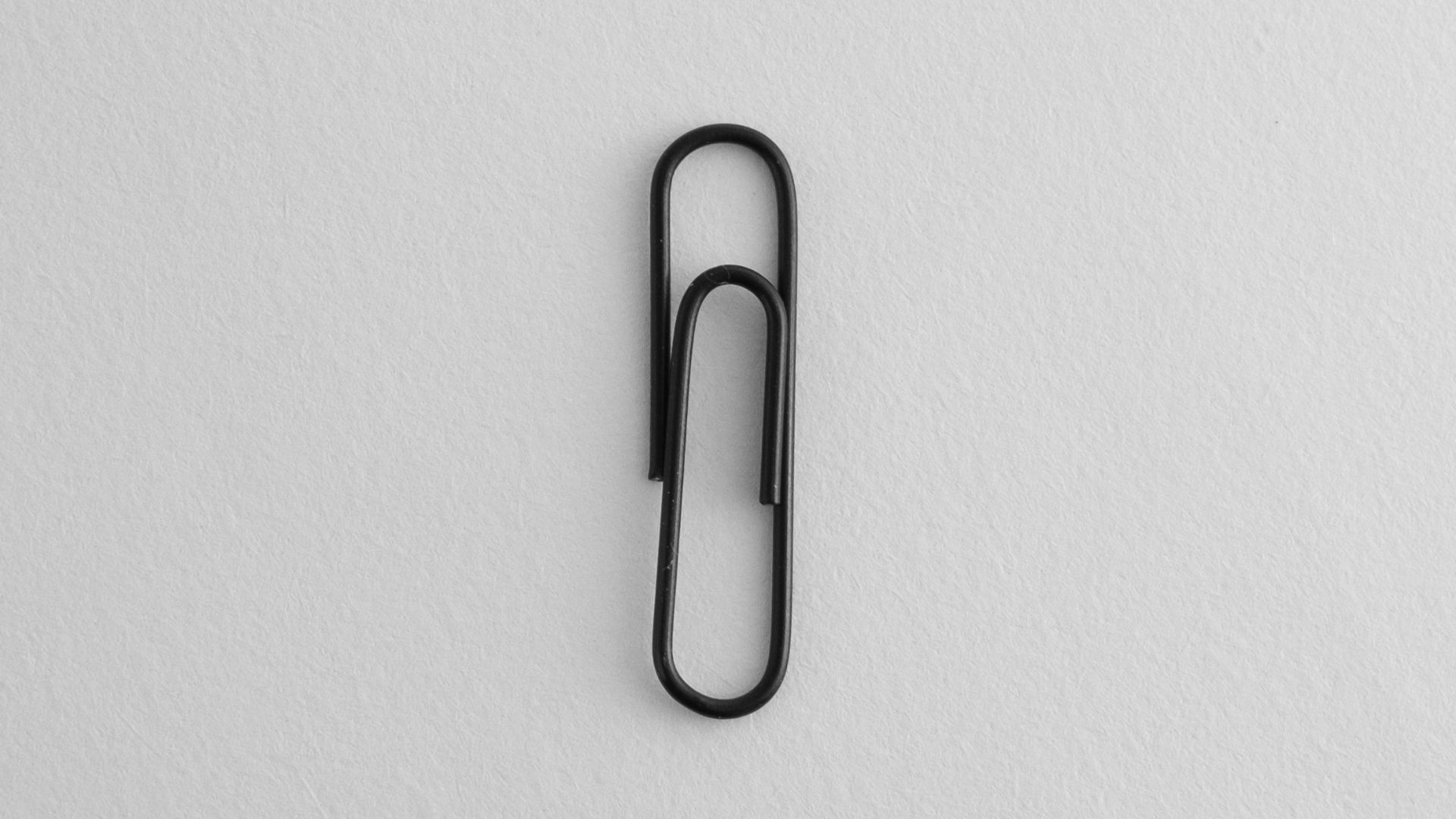 A black and white photo of a paper clip