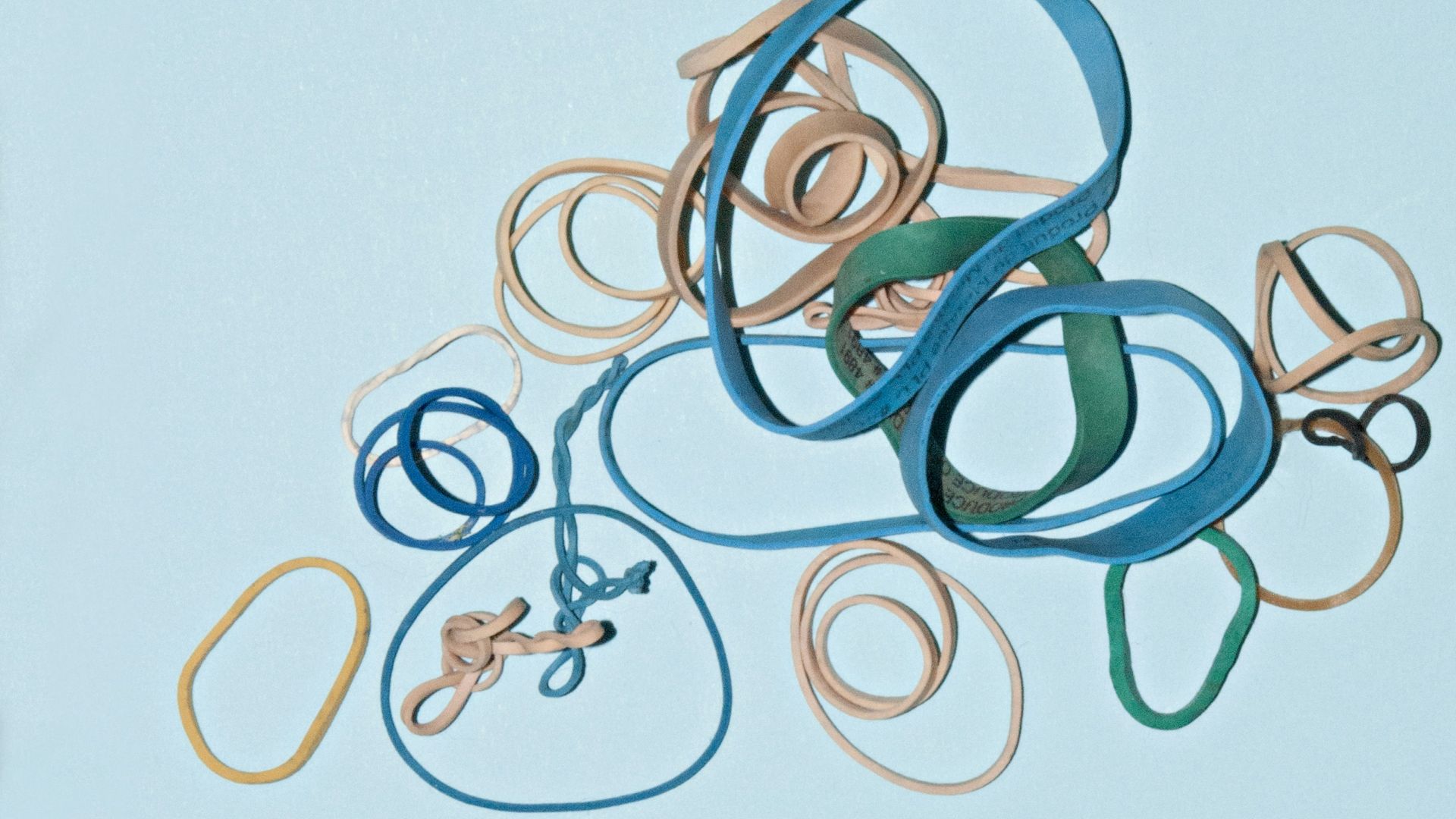 beige, yellow, and blue loom bands