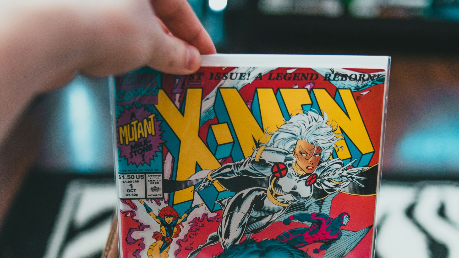 person holding dragon ball z comic book