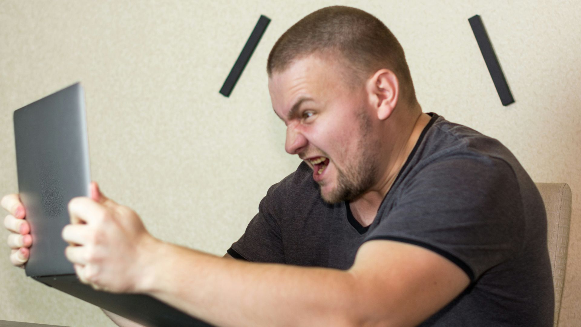 a man sitting in front of a laptop computer