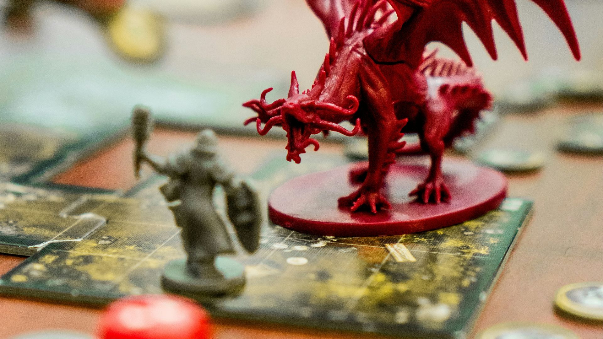 red dragon action figure on table