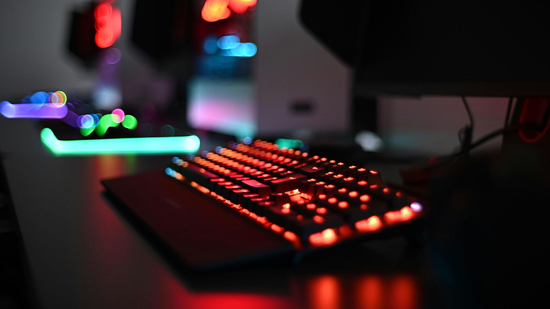 a computer keyboard sitting on top of a desk