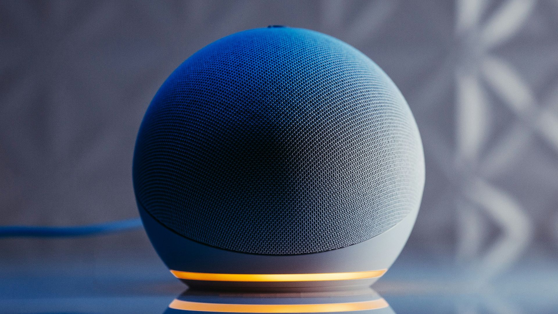 a blue ball on a black surface
