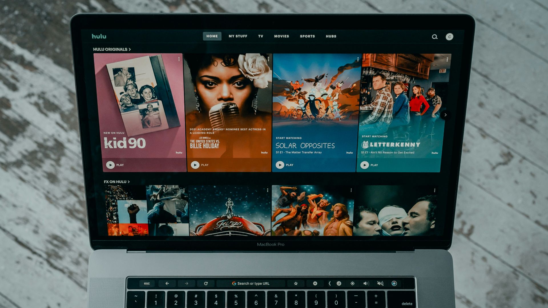 macbook pro on white table