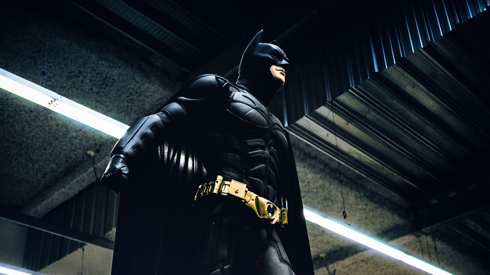 Batman standing under steel roof