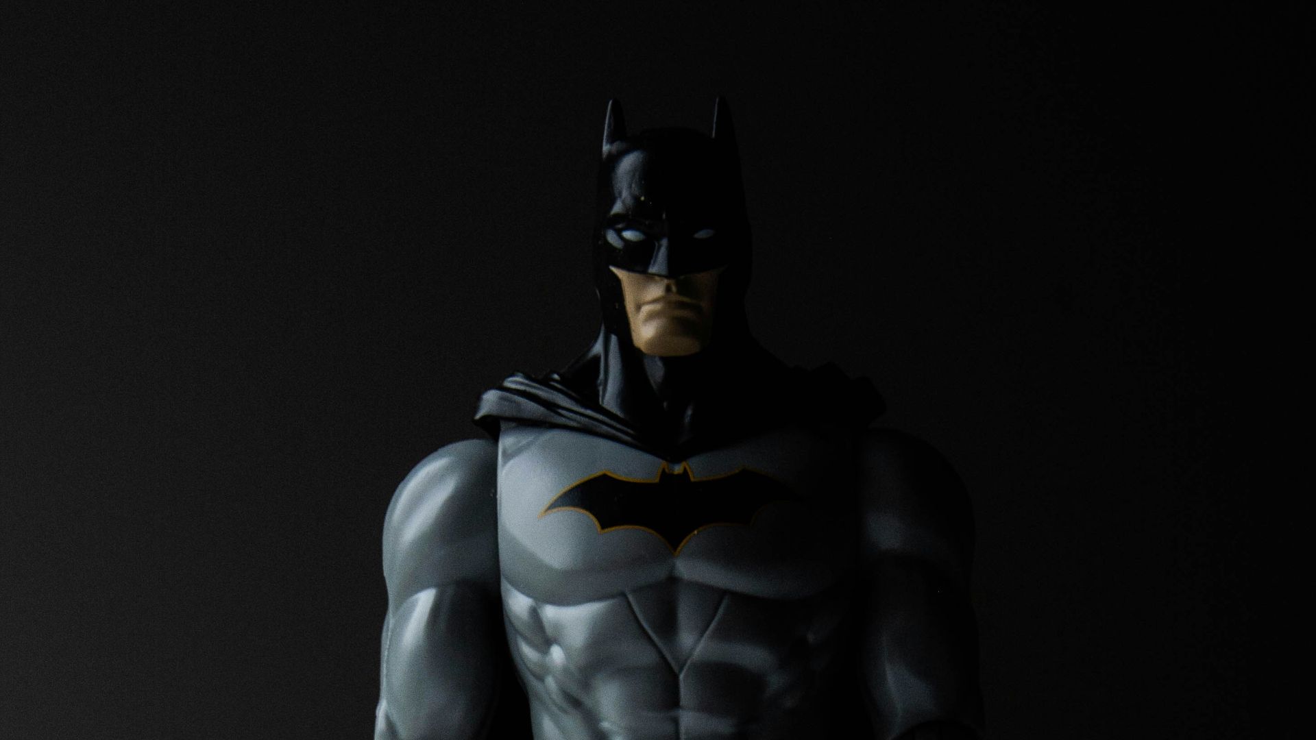 man in black and yellow suit