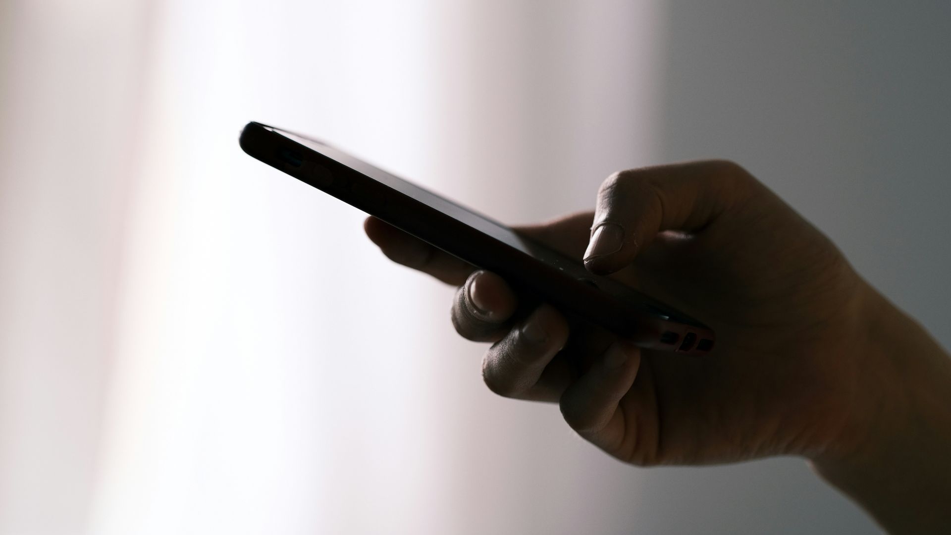 person holding black android smartphone