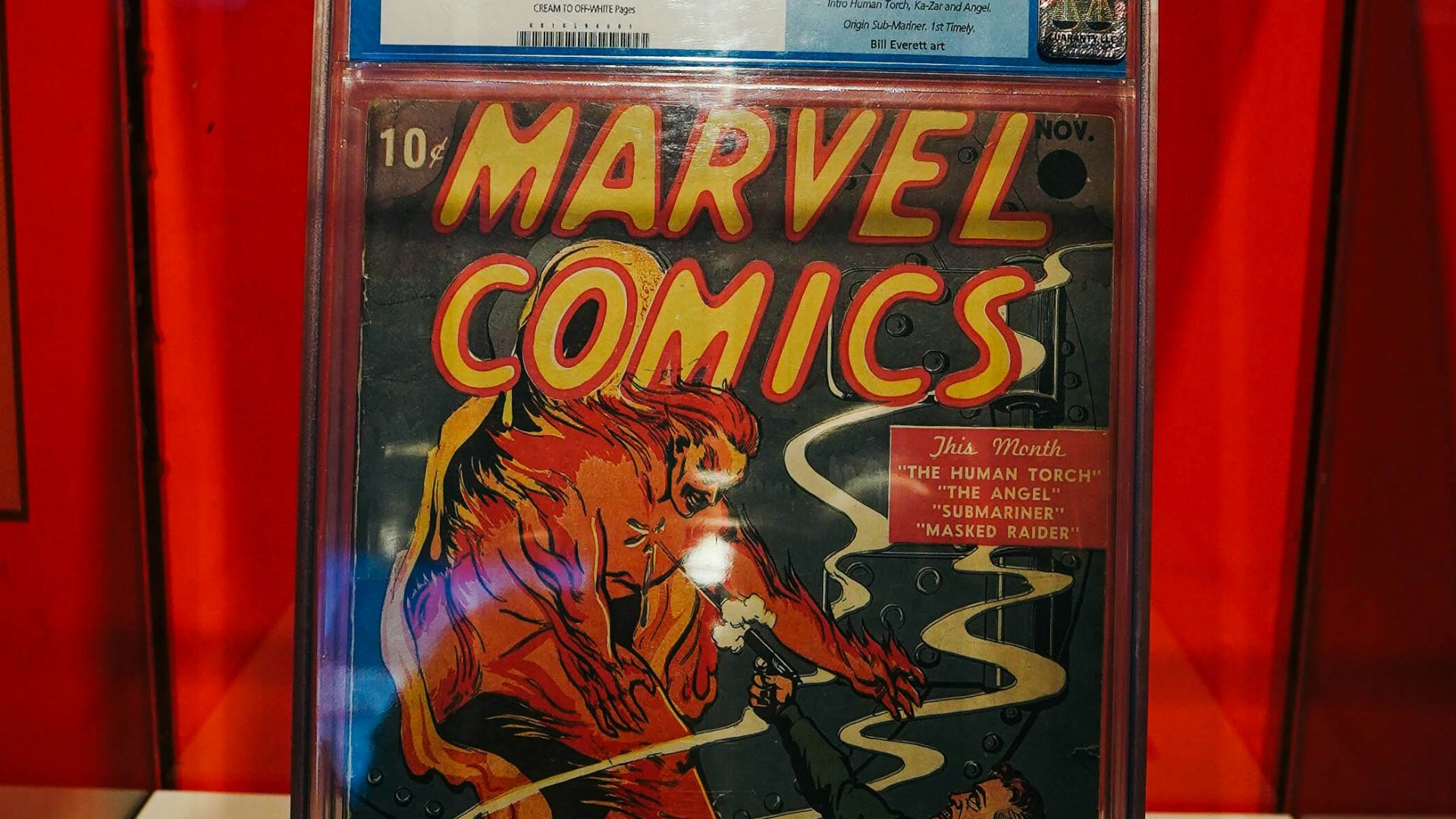 a comic book on display in a glass case