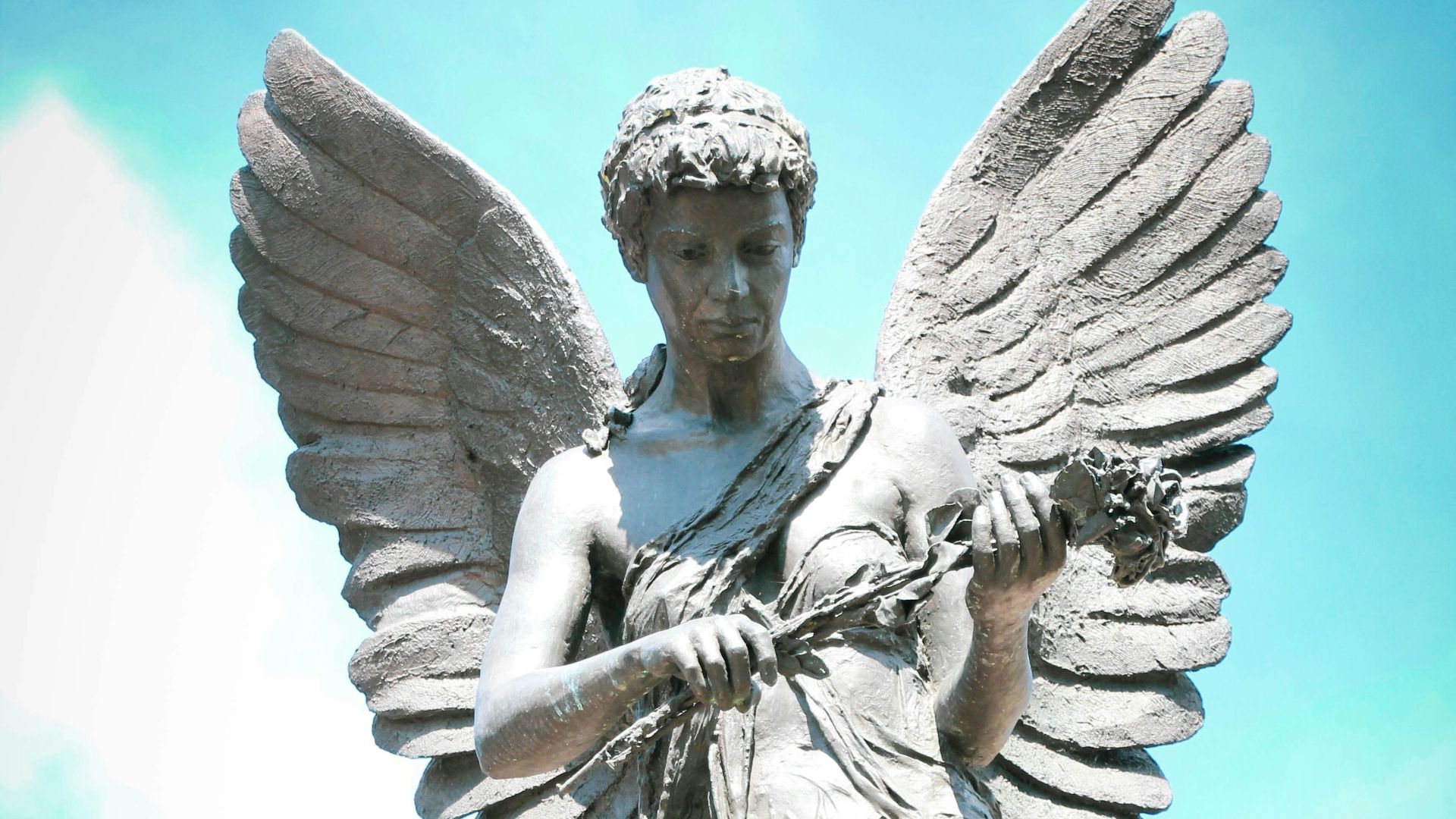 angel statue under blue sky during daytime