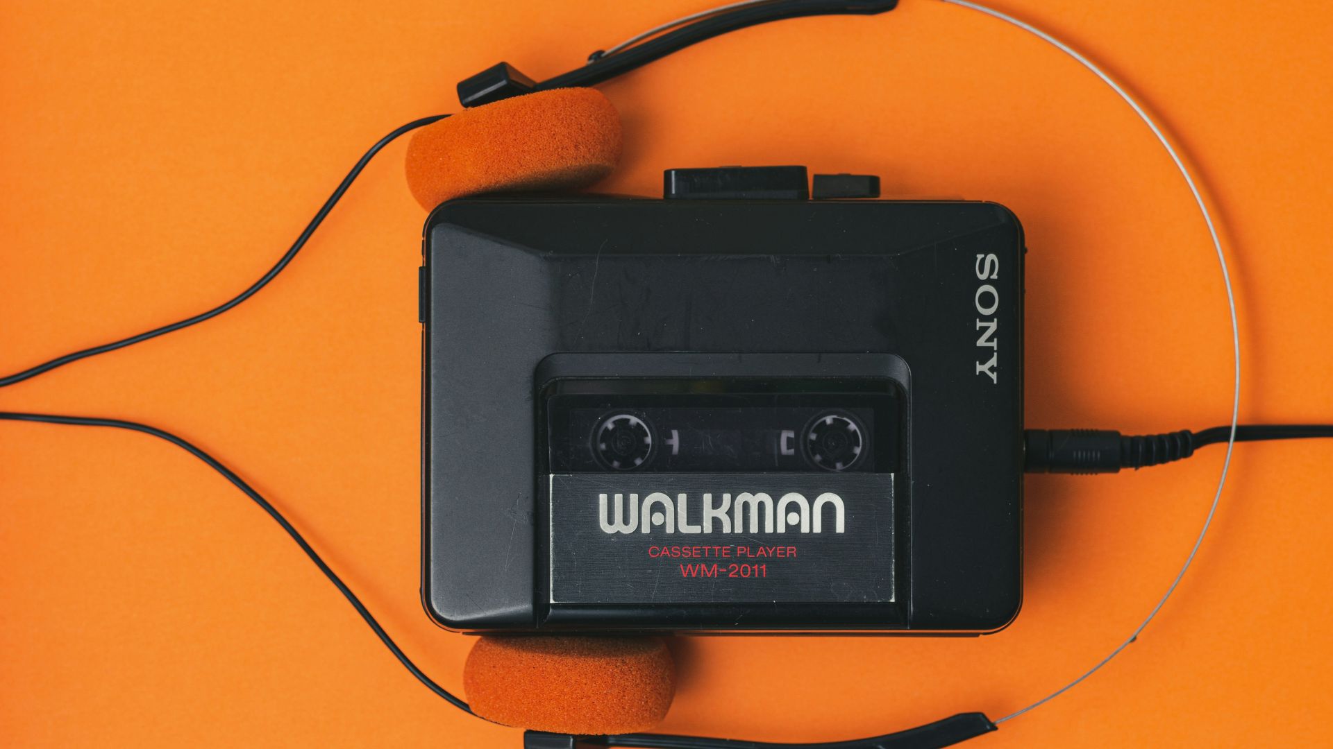 a cassette player with headphones attached to it