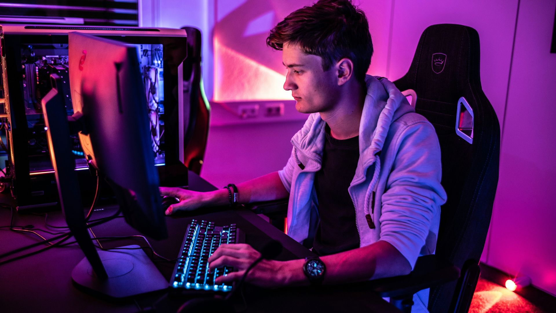 a man sitting in front of a computer keyboard