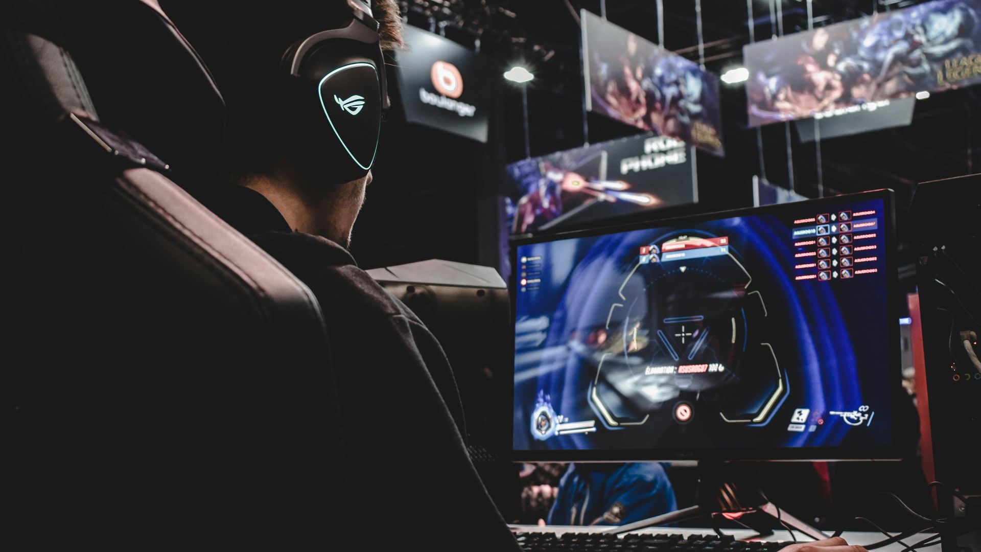 person sitting on gaming chair while playing video game