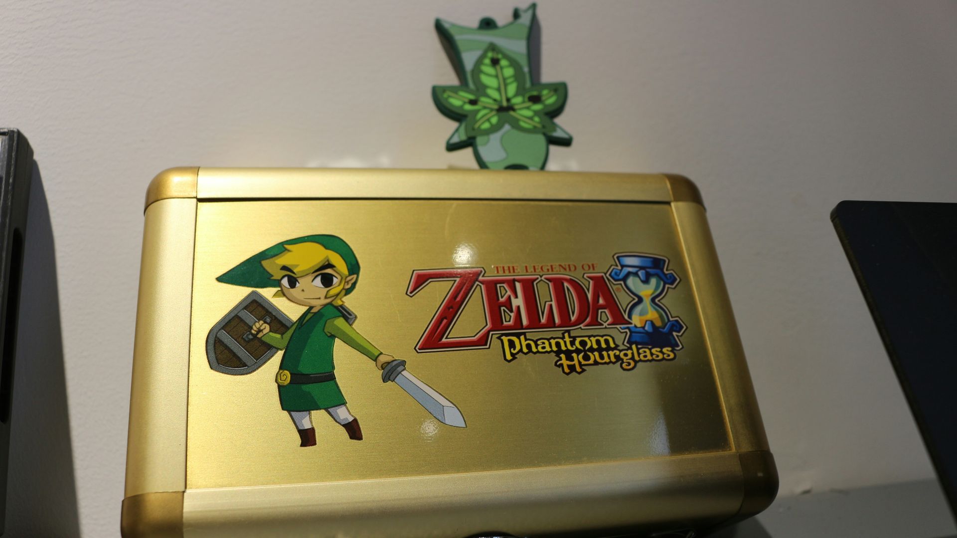 A nintendo wii game system sitting on top of a desk